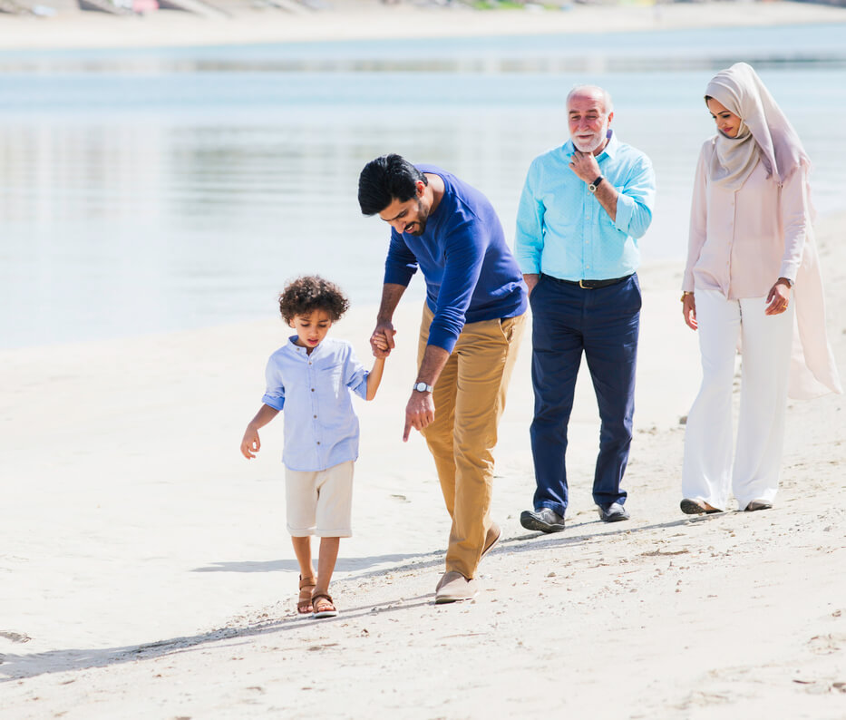 Family enjoying the beach on a walk in Dubai