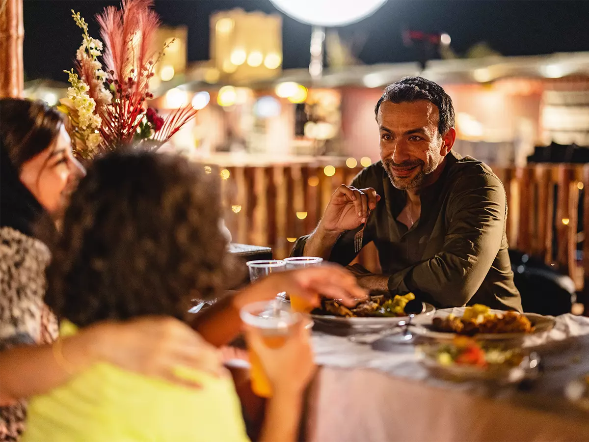 Family enjoying dinner outside 