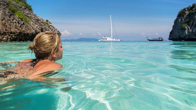 Woman swimming in clear waters